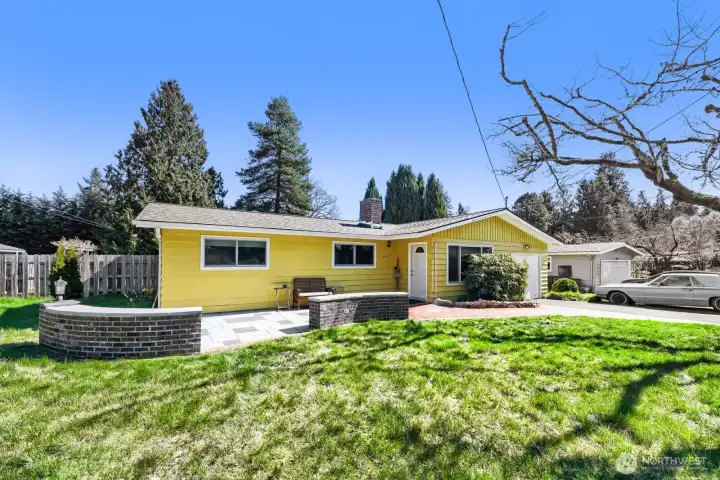 Street view of the front; there is additional gravel parking in front.