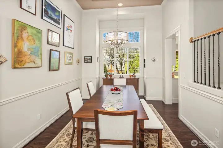 The semi formal dining room off the kitchen & living room & lovely views looking into the backyard
