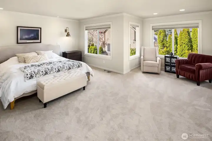 You will love this over sized primary bedroom suite that overlooks the backyard. Nice sitting area or space for desk off the the right side of this photo