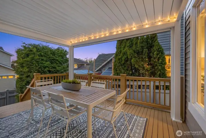 This pergola cranks open and shut and has pull down screens on two sides to reduce solar heat.