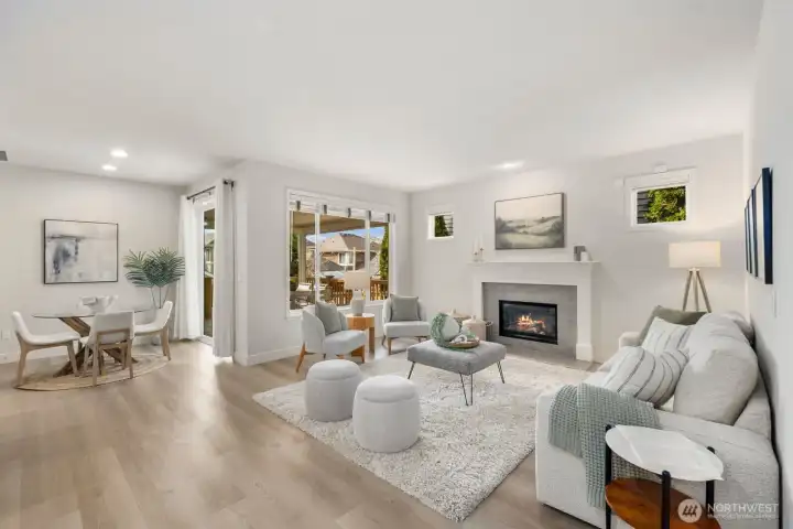 Great room, with kitchen, living room, informal dining area, and a view of the back deck.