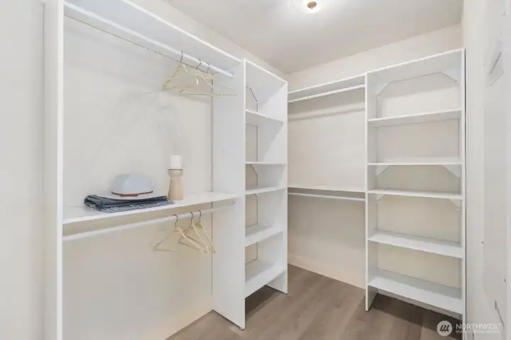 A partial view of the walk-in closet in the primary.