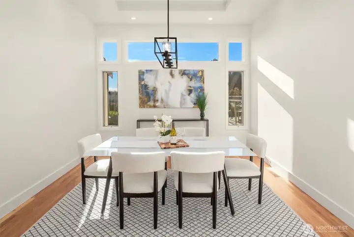 Formal dining — elegant table framed by soft light, perfect for intimate dinners and grand celebrations.