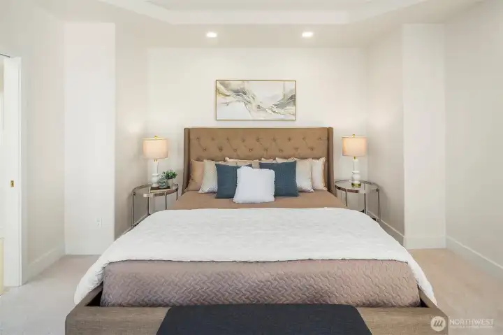 Main-level primary suite with private deck access and panoramic views.