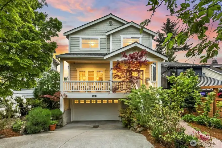 Gorgeous landscaping, 2-car garage, inviting large front porch