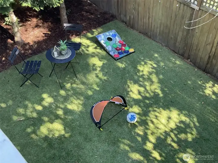Part of yard viewed from balcony. Great play area.