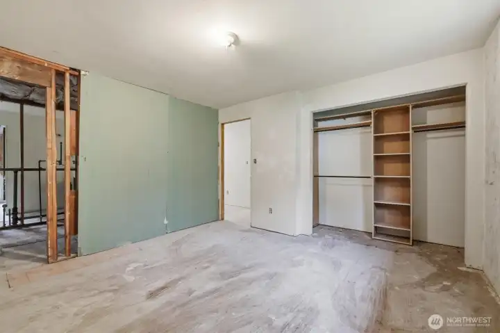 Current primary bedroom with closet and ensuite bath located on left.