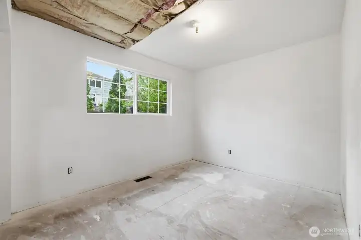 Current third bedroom with backyard views.
