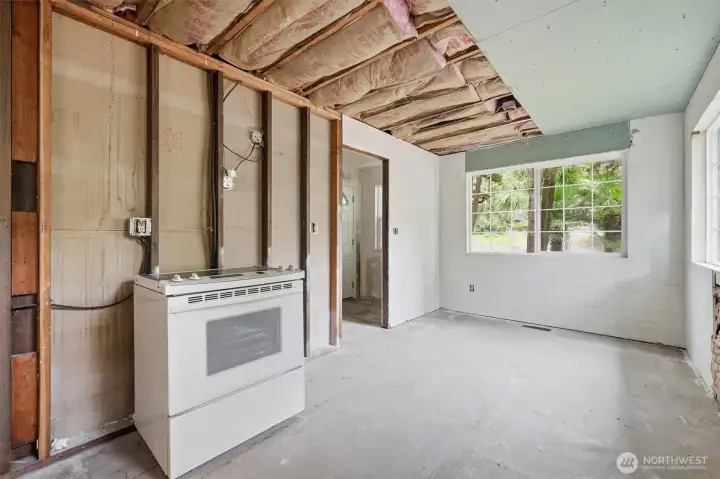 Current kitchen with great natural light and exposure to front of property and entry.