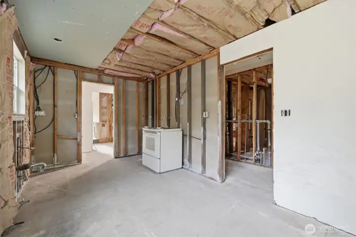 Current kitchen with access to garage and mudroom.