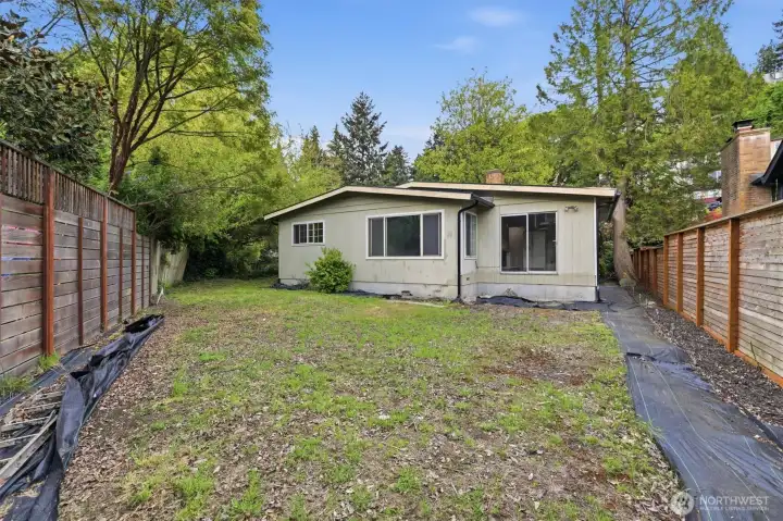 A flat and spacious backyard. The lot is partially fenced and could easily be fully fenced.