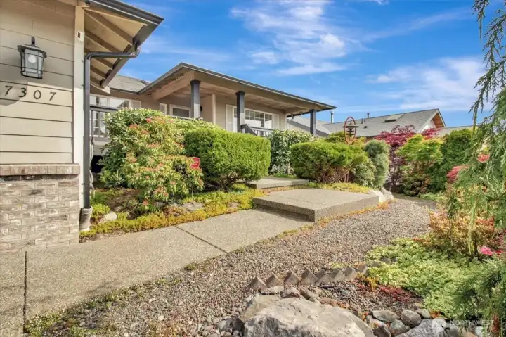 Path to front door with expansive covered patio