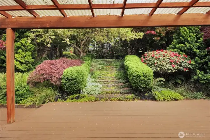 View of secluded garden off back yard deck.
