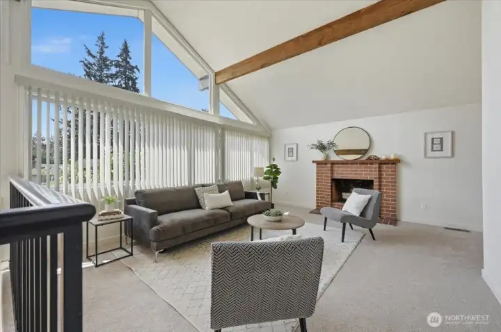 Main level: Living room. Freshly painted and new flooring. South-facing and always bright!