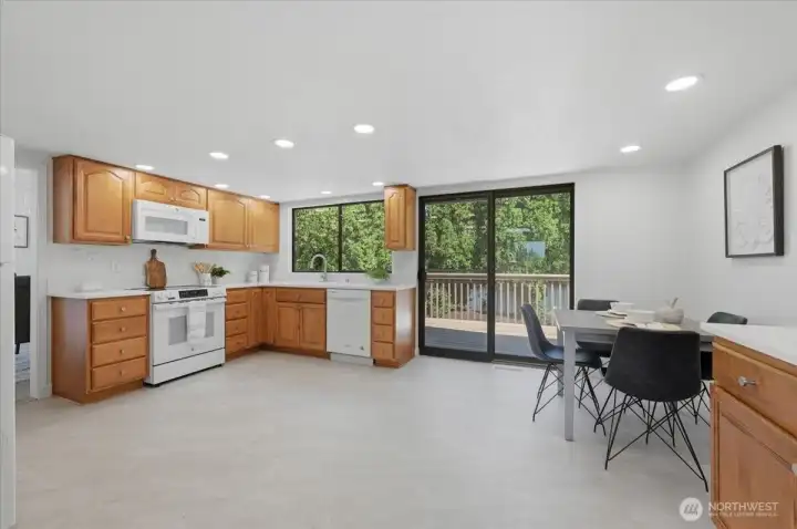 Eat-in kitchen with new LVP flooring, new quartz countertops and freshly painted.