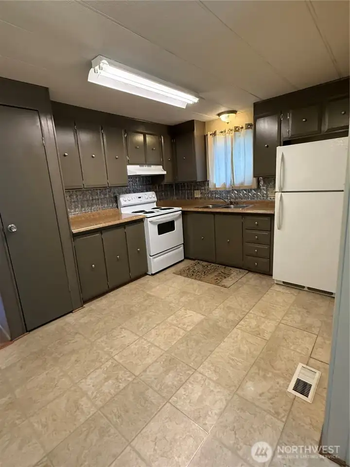 Kitchen with new flooring, all new plumbing