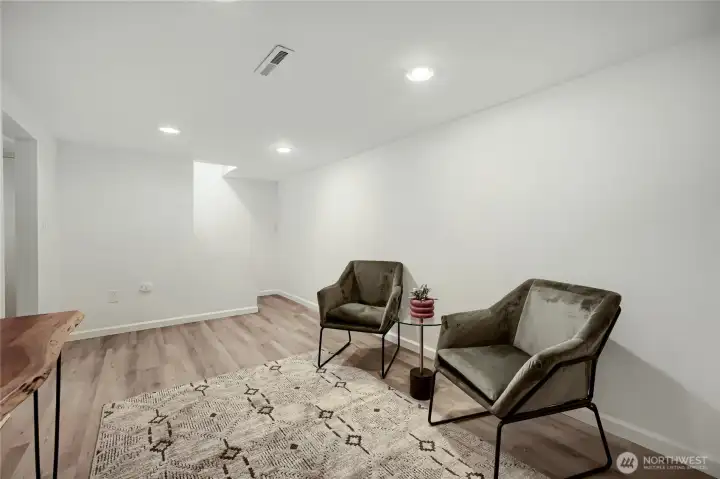 This versatile lower-level space offers endless possibilities—perfect as an entertainment room, home office, movie lounge, or creative flex area. Freshly updated with recessed lighting, smooth walls, and durable flooring, it provides a clean, modern backdrop ready to suit any lifestyle need. Whether you’re hosting game nights, working from home, or simply relaxing, this functional room adapts beautifully to your everyday living. This versatile lower-level space offers endless possibilities—perfect as an entertainment room, home office, movie lounge, or creative flex area. Freshly updated with recessed lighting, smooth walls, and durable flooring, it provides a clean, modern backdrop ready to suit any lifestyle need. Whether you’re hosting game nights, working from home, or simply relaxing, this functional room adapts beautifully to your everyday living.