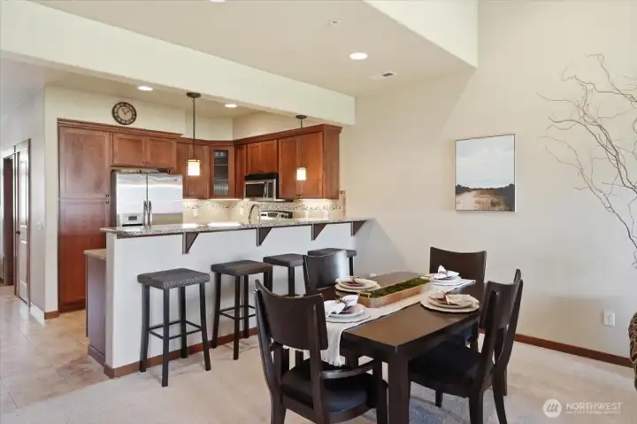 Kitchen with eating bar & Dining room area Kitchen with eating bar & Dining room area