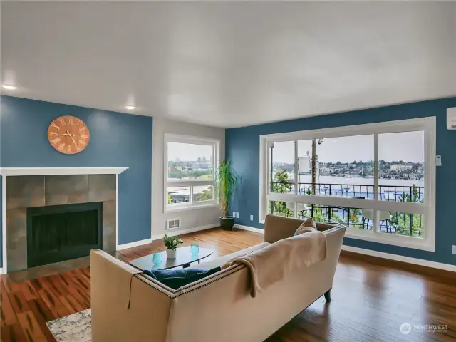 Large living room with wood burning fireplace.