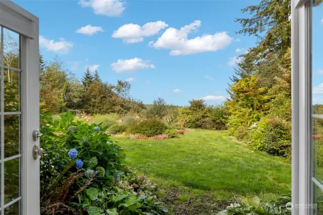 View of the garden from the primary suite french doors.