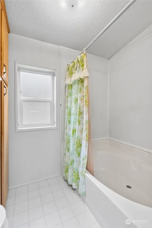 Updated Bathroom w/Vinyl Floors and Soaking Tub/Shower