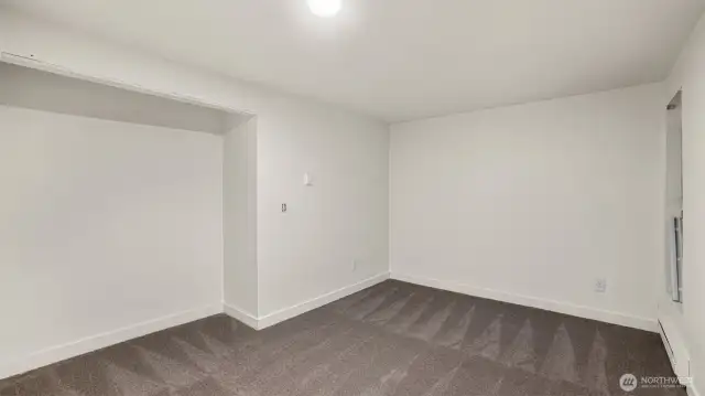 Another sizable guest bedroom with open closet.