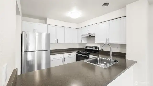 Kitchen opens to the living and dining room areas; perfect for entertaining.