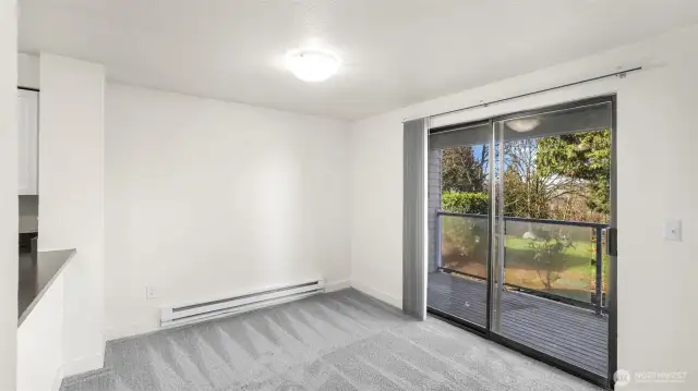 Dining space with slider that leads to your private balcony providing an abundance of light.
