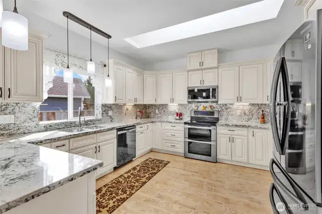 Its well known that kitchens are gathering spaces no days. Imagine the memories that will be made in this amazing space. Designer pendant lighting, skylight, undermount sink, stove with double oven. You may never want to leave.