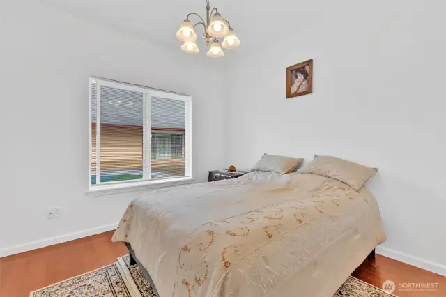 Bedroom 3 gets plenty of natural light. Hardwood floors and plenty of room for guests or family