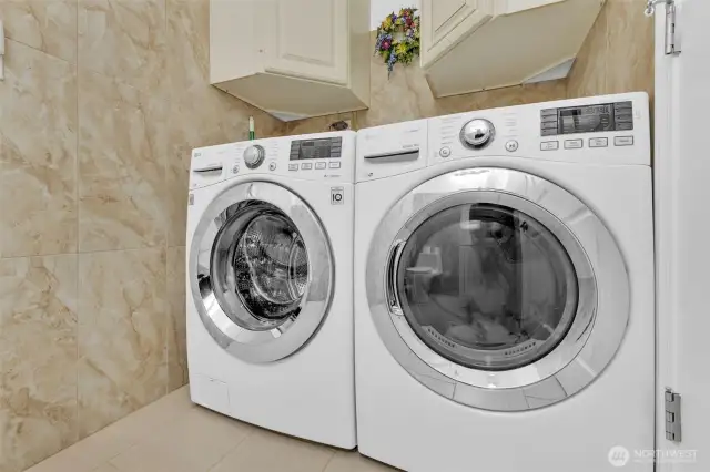 Laundry is conveniently located to the bedrooms. Cabinets can hold all your laundry supplies and extra linens.