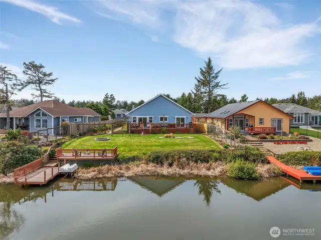 Looking at the custom built dock, there is room for your boat and yard space to play.