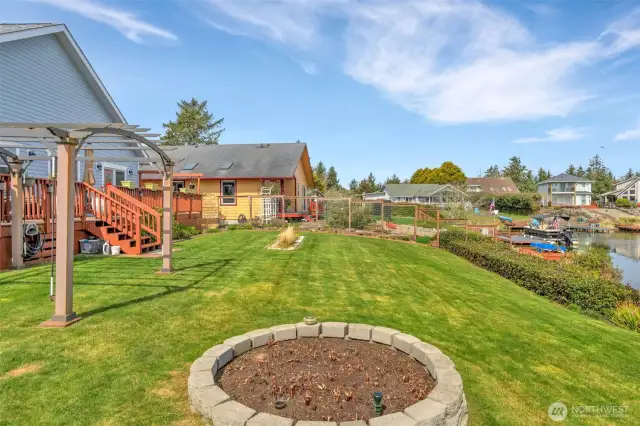 Gazebo on the left and a view of the manicured back yard.