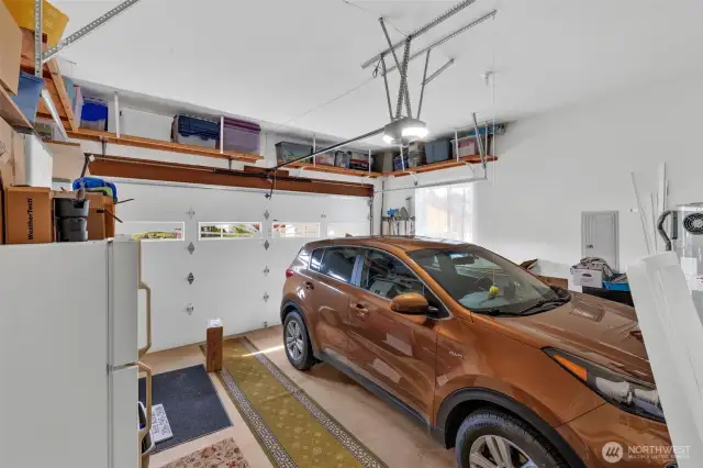 Spacious garage with upgraded door opener that has a battery back up in case the power goes out.  There is so much room.  2 cars can easily fit and there is space for hobbies. The owner has only 1 car and chooses to park in the middle.