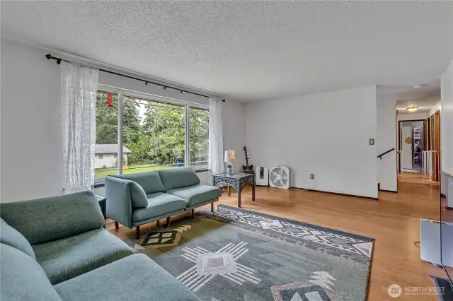 Living room with large bay window.