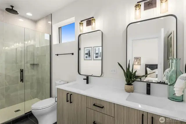 Sleek fixtures and a soft color palette create a calming retreat in this modern bathroom.