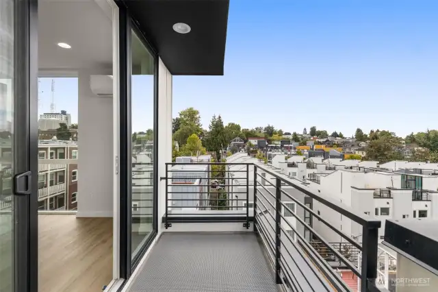 Enjoy your private balcony with views of Seattle's iconic neighborhoods. The perfect spot to start your day or relax at sunset.