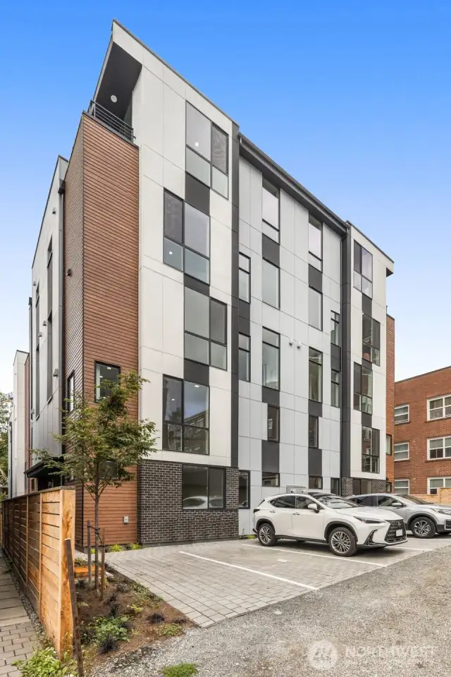 Modern architecture meets urban convenience with EV-ready parking.