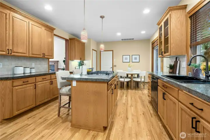 Extensive refinished hardwoods throughout kitchen, family rm & entryway