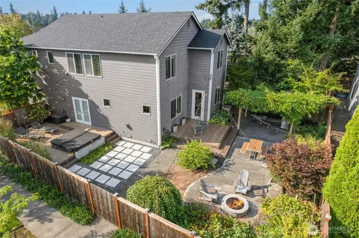 Large corner lot features this expansive back and side yard