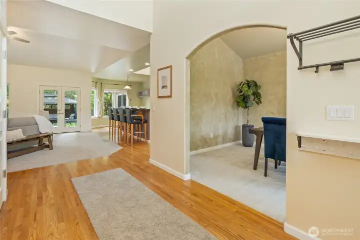 Open concept great room, with formal dining room to right and den to left