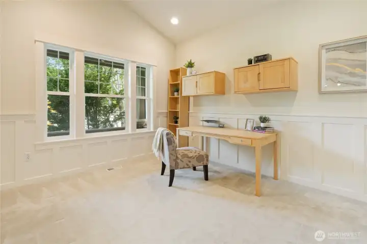 French doors lead to light filled office space