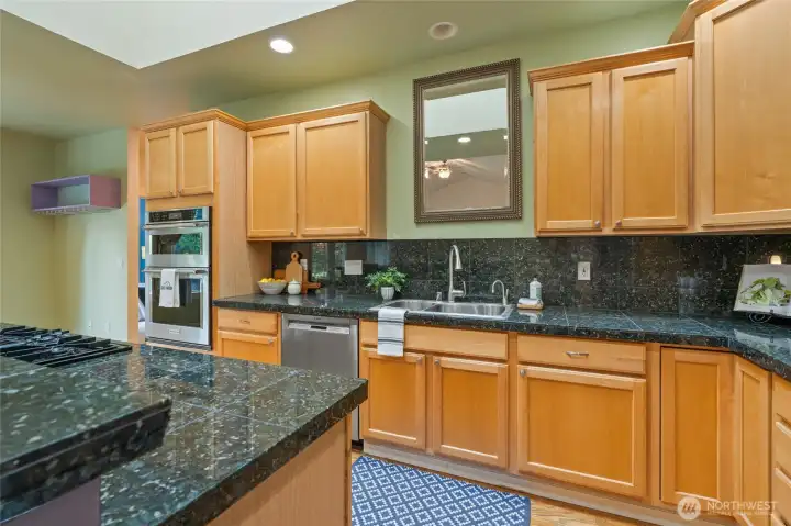 Updated appliances all convey as do the bar stools