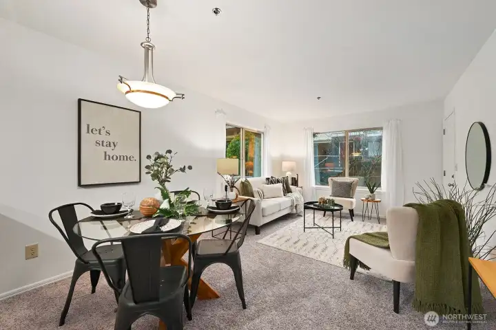 Enjoy a meal in the comfortable dining area. New carpet and paint throughout the condo.