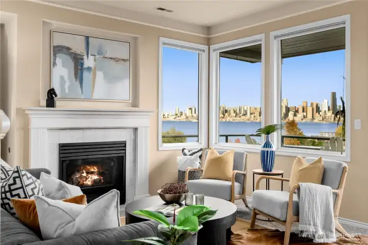 This corner unit home has so many wonderful windows featuring these incredible Seattle views!