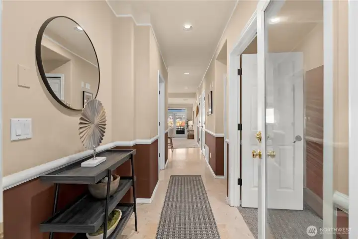 The entrance is lovely. There is a coat closet just past the bonus room/den/office on the right.
