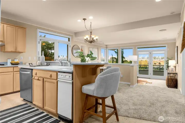 After coming down the entrance hall - this open floor plan and windows are stunning!