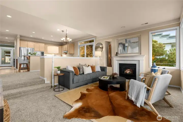 This view shows the living room looking towards the dining and kitchen.