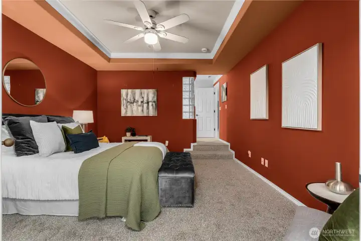 This photo shows the main bedroom looking towards the adjoining en suite bathroom and walk-in-closet.