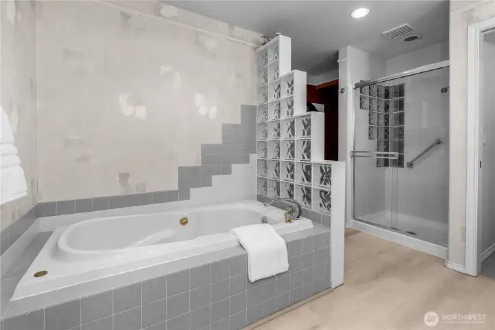 The primary bath also includes a large, jetted soaking tub and separate shower!